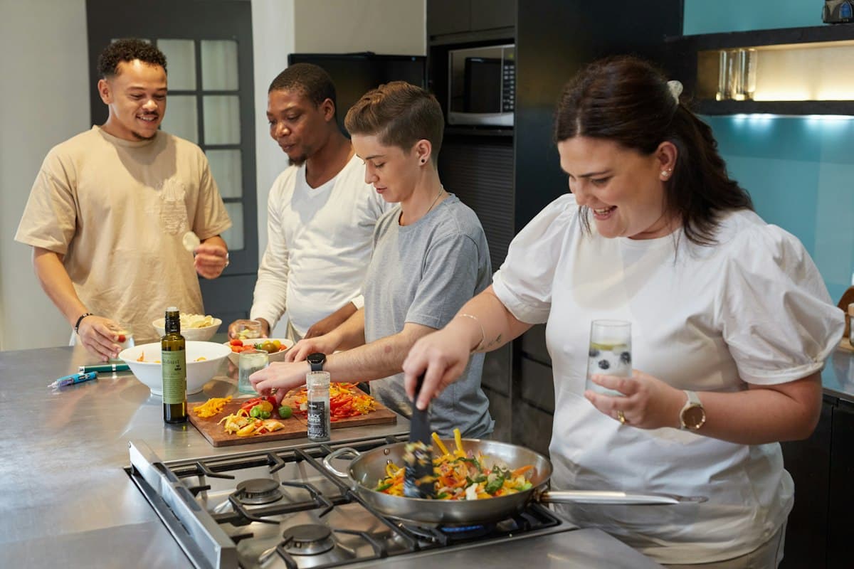 Residents cooking together in a shared kitchen